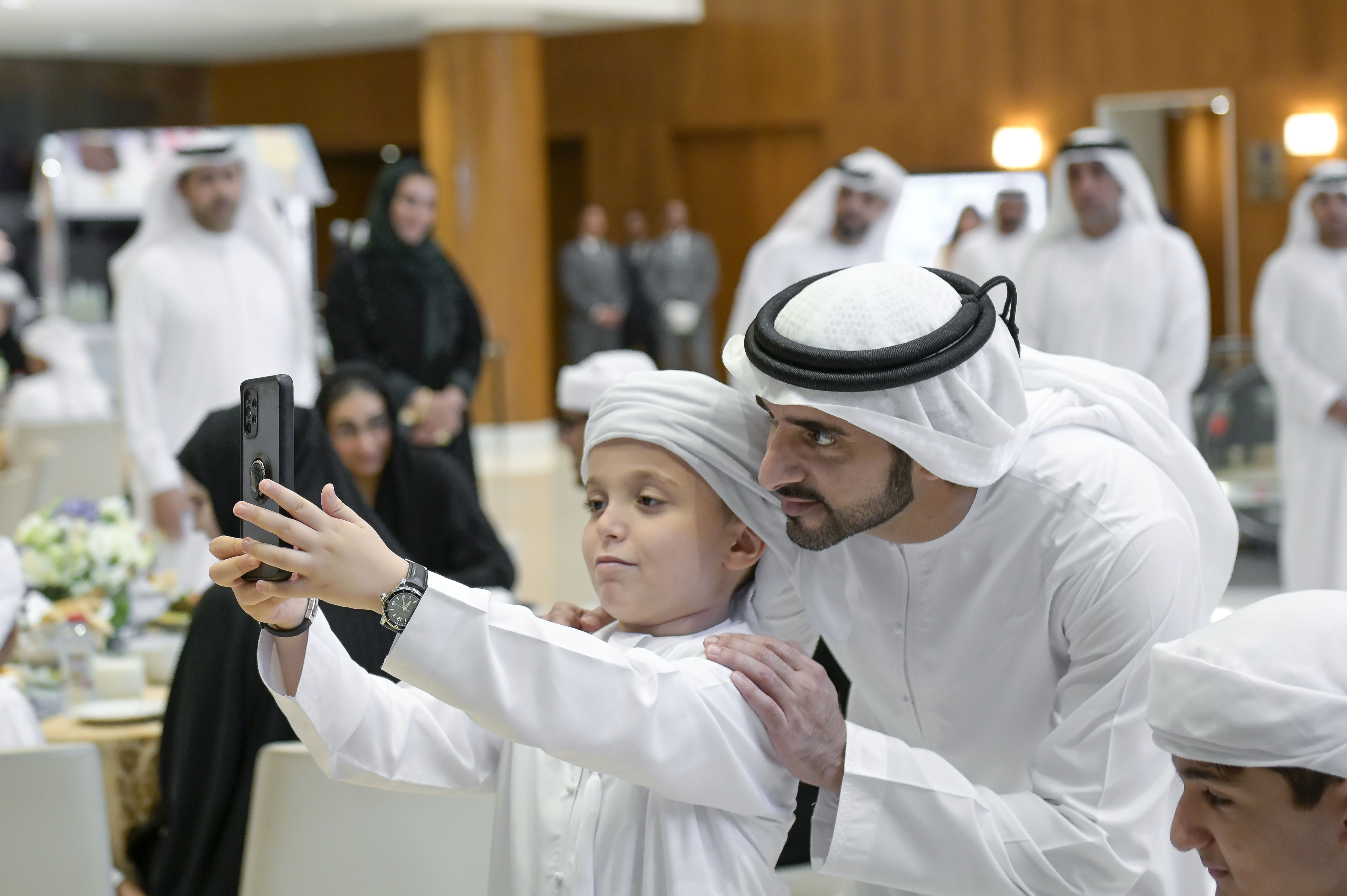 Hamdan bin Mohammed attends Iftar banquet with autistic children